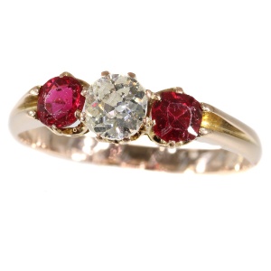Antique ring with old mine brilliant cut diamond and two red strass stones